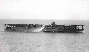 Imperial Japanese Navy Carrier Kaga: photo taken after her massive refitting. Its smokestack is directed downwards to extinguish the smoke with seawater.